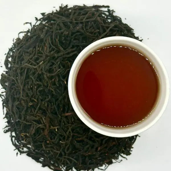 Lychee loose-leaf black tea brewed in a cup — Dragon Girl Tea