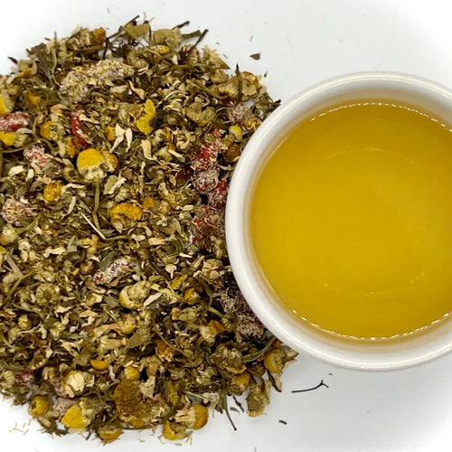 Yummy Tummy herbal tisane loose blend with a brewed cup - Dragon Girl Tea